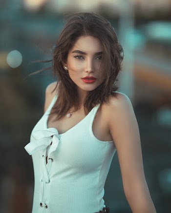 Women Wearing White Tank Top Posing for a Photo