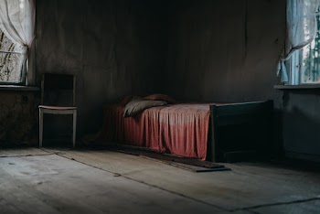 Wooden Bed Beside Window