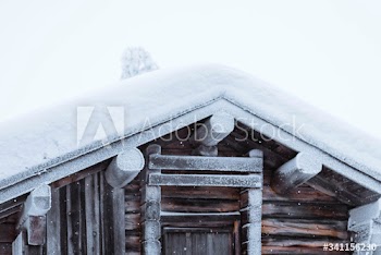 Wooden cabin in a snowy forest in Finland