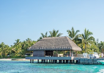 Wooden Cottage Above Water