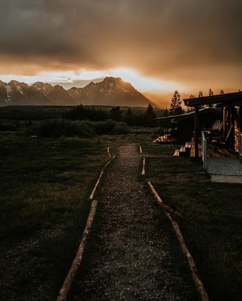 wooden house near mountain during golden hour