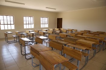 Wooden tables in a classroom. | Free Photo - rawpixel
