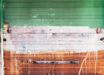 wooden wall with brown and green paint