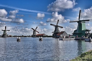 Wooden Windmills Near Lake