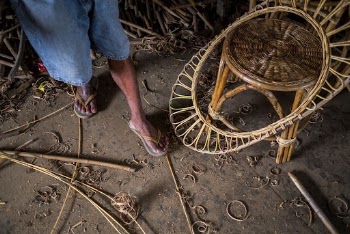 Worker rattaning a basket. Free | Free Photo - rawpixel