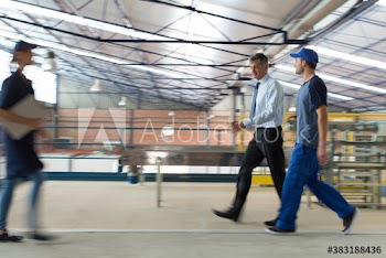Workers and manager working in factory