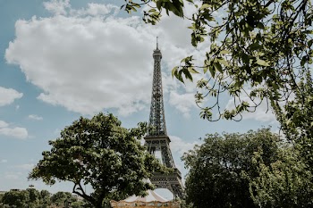 Worm's-eye View of Eiffel Tower Under Cloudy Sky