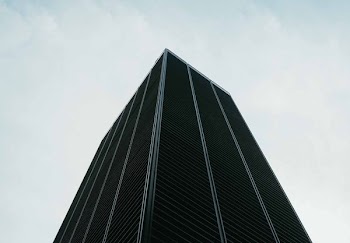worm's eye view of black buildings