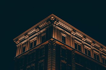 worm's-eye view of building during nighttime