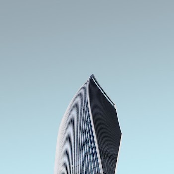 worm's eye view photography of glass tower