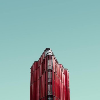 worm's eye view photography of red glass building