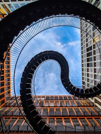 worm's-eye view photography of spiral stairs