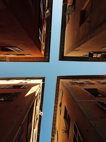 Worms Eye View of 4 Brown Concrete Buildings at Daytime
