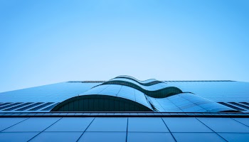 Worms Eye View of City Building Under Blue Sunny Sky