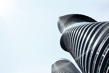worms eye view of gray concrete building during daytime