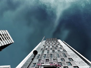Worms Eye-view Photography of White High-rise Building during Storm Weather
