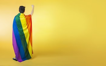 Wrapped Lgbt Flag Holding Fist Up