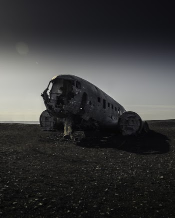Wrecked Gray Airliner on Ground