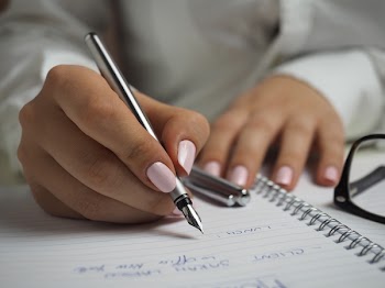          Writing on Notepad Free Photo     