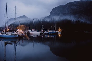 yacht beside mountains