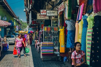 Yangon, Myanmar - FEB 19th 2014: People walking on the street out of Bogyoke Aung San Market