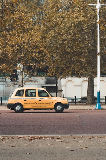 Yellow 5-door Hatchback Parked Near Trees