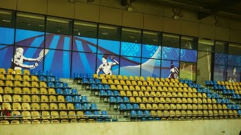 Yellow and Blue Seats Inside Court