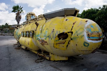 Yellow and Gray Submarine on Gray Pavement