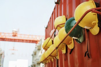 Yellow and Green Hard Hat on Rack