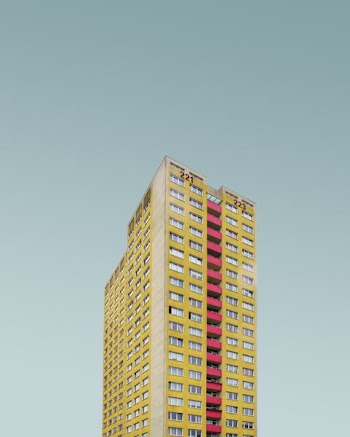 yellow and red high rise building