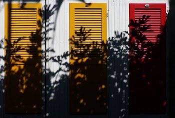 yellow and red wooden closed doors