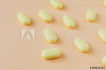 Yellow antibiotics on a beige background