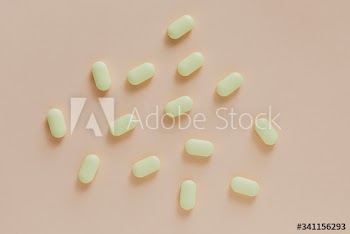 Yellow antibiotics on a beige background