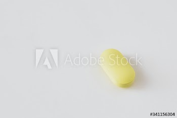 Yellow antibiotics on a white background