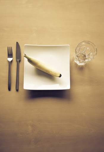 Yellow Banana on White Square Plate