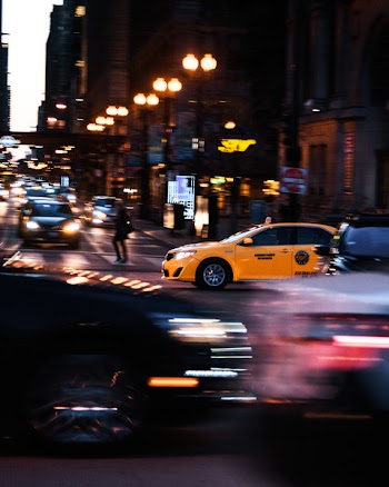 Yellow Car Passing on Road