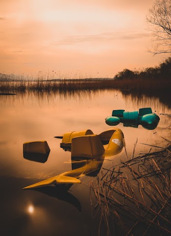 Yellow Chair on Body of Water