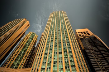 Yellow Concrete Building Under Dark Sky during Night Time