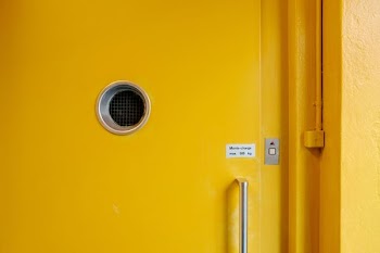 yellow door with button