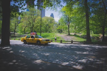 Yellow Ford Crown Victoria on Gray Concrete Pathway