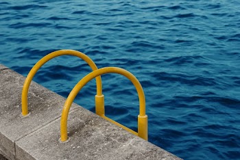Yellow handrail for swimming pool
