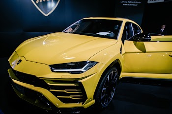 Yellow Luxury Car Near Man