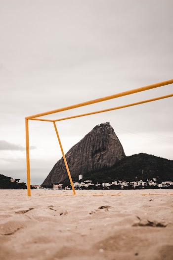 Yellow Metal Monkey Bar Beside Rock Formation