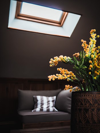 Yellow Petaled Flower Centerpiece In Brown Vase