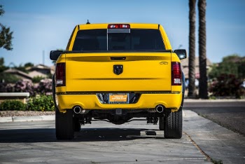 Yellow Pick-up Truck on Grey Concrete Road