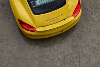 yellow Porche car parked on road