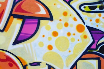 yellow, purple, and orange wall graffiti