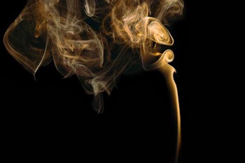 yellow smoke in black background