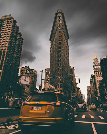 Yellow Toyota Rav4 Suv Running on Road Near Flatiron Building, New York