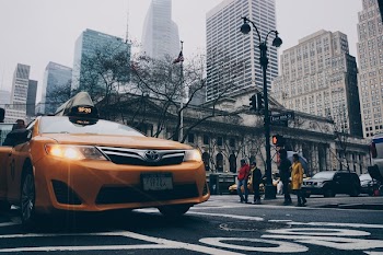 Yellow Toyota Sedan on in Highway Road